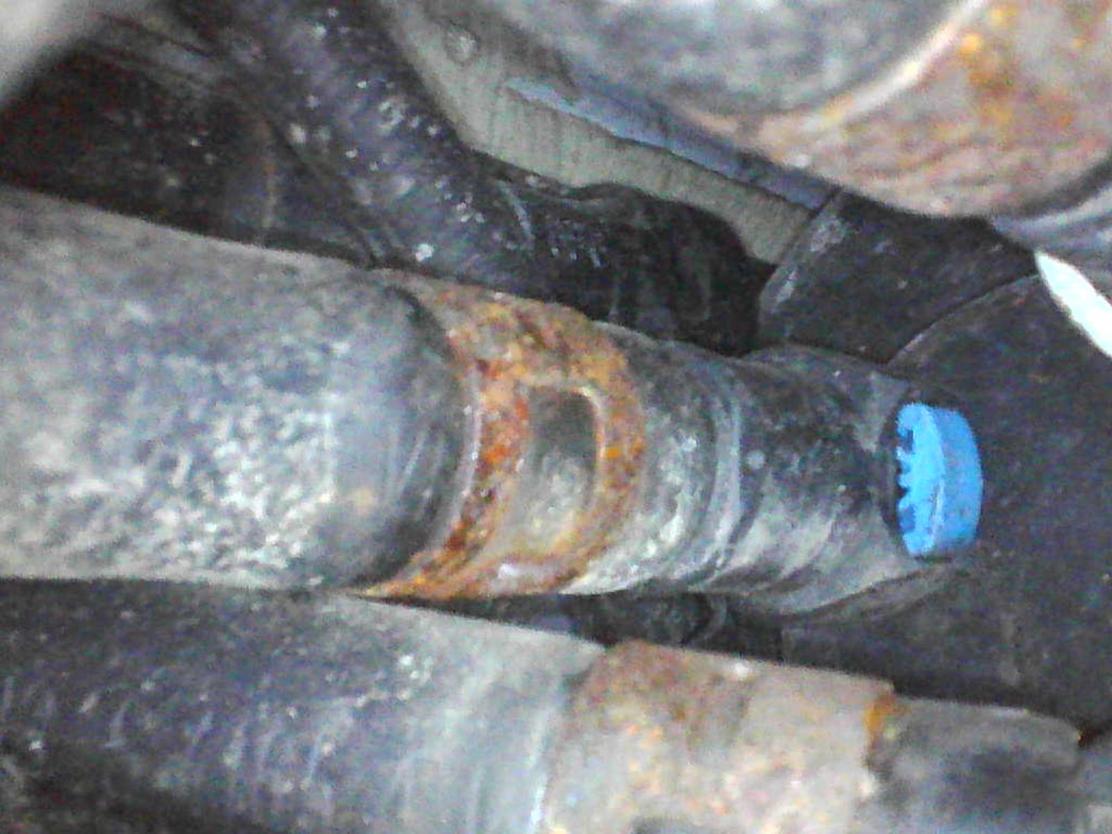 Rusted clips behind heat shield offside.jpg