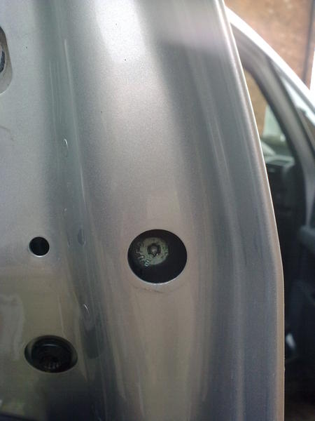 Remove plastic cover to reveal a T20 screw, screw this in to remove rear part of the door handle (screw it all the way in) you will see it moving on t